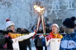 «Поцелуй» двух факелов — символ преемственности в олимпийском движении
